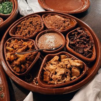 D' La Santa signature dishes CrispitosNopalCochinita Pibil